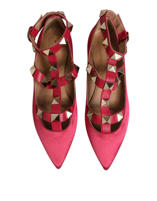 Pair of red high heel shoes with gold studs