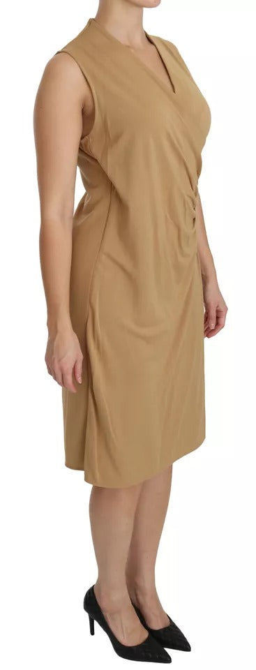 A woman wearing a brown viscose knee length dress with a V-neck