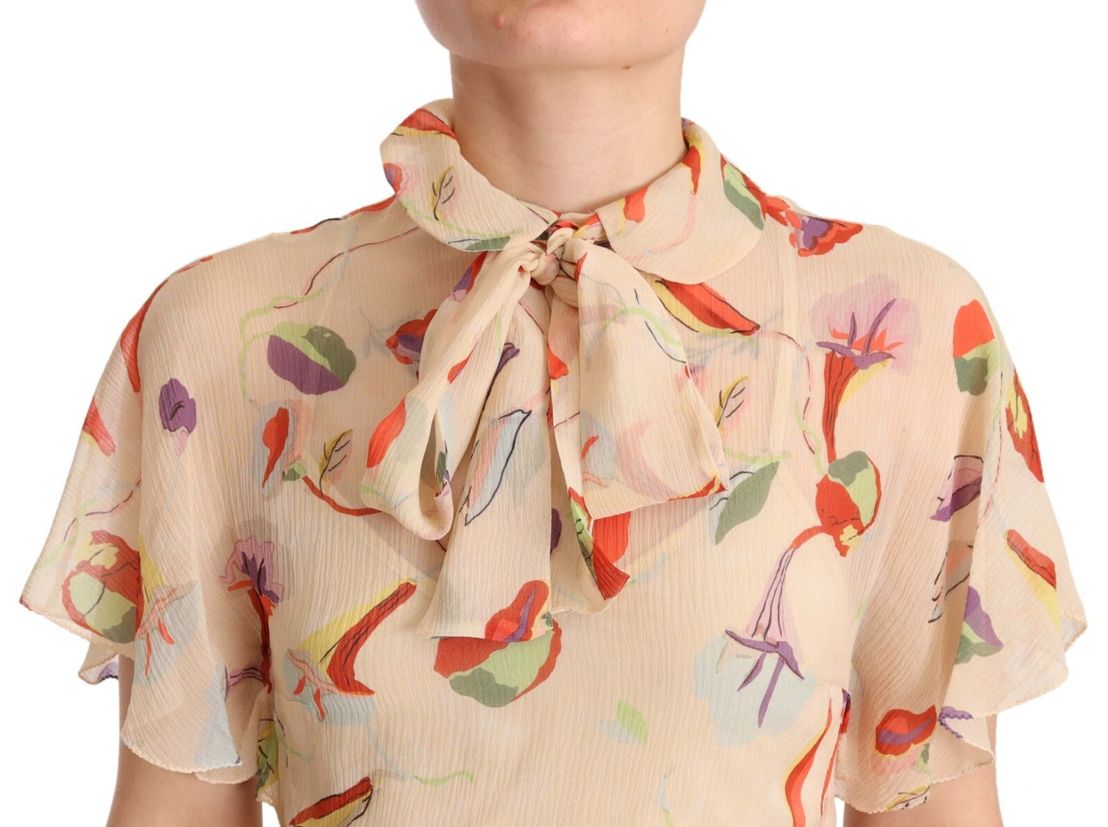 A beige dress with a red floral pattern and an ascot collar, short sleeves, and a mini length