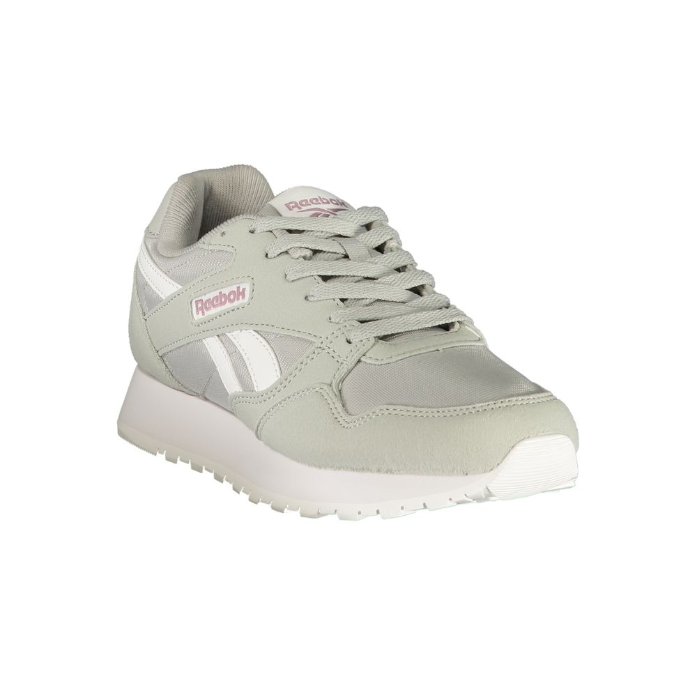 A gray women's sneaker with white sole, laces, and logo