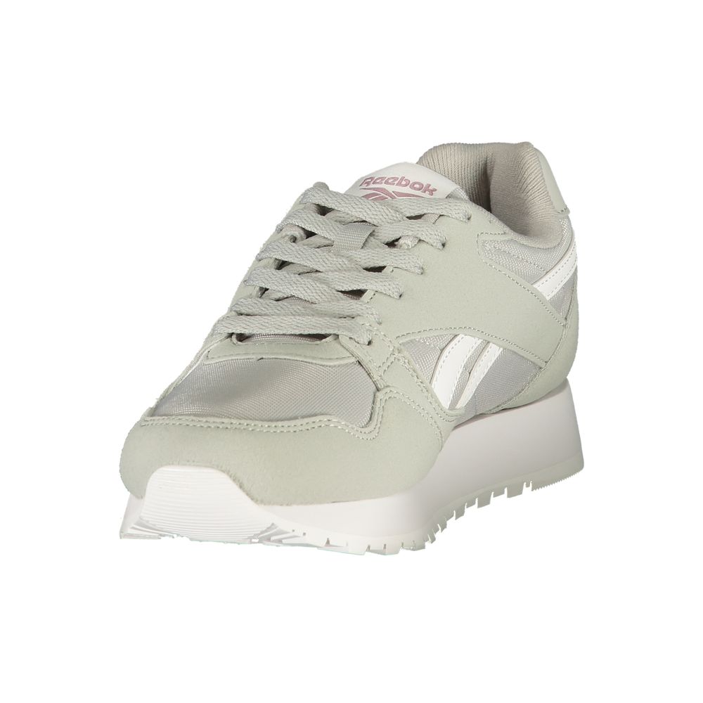 A gray women's sneaker with white sole, laces, and logo