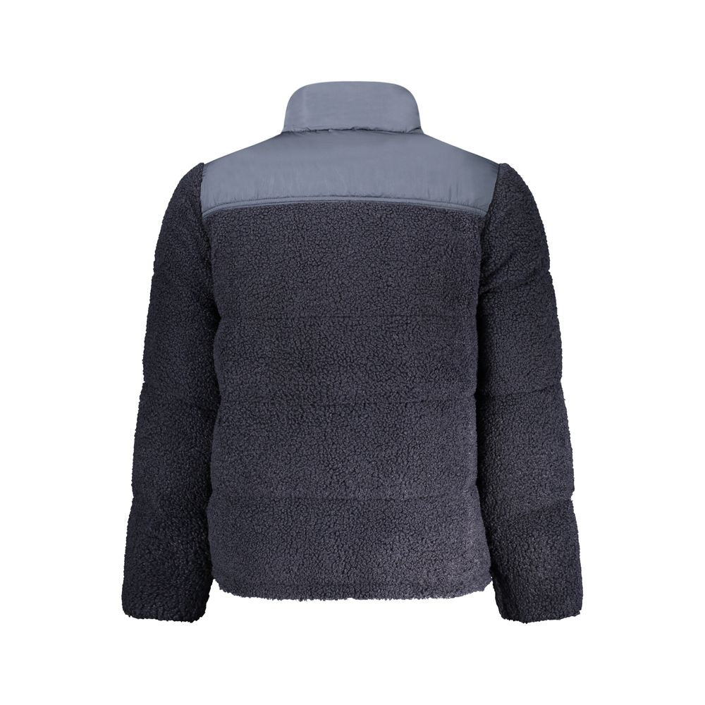 The jacket is dark blue with a white stripe on the sleeve