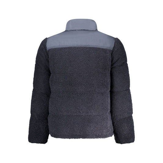 The jacket is dark blue with a white stripe on the sleeve