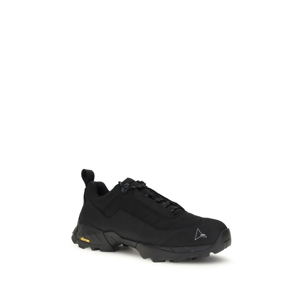 A pair of black athletic sneakers with yellow accents, featuring a polyamide upper and rubber sole
