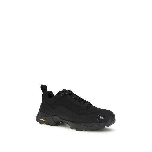 A pair of black athletic sneakers with yellow accents, featuring a polyamide upper and rubber sole