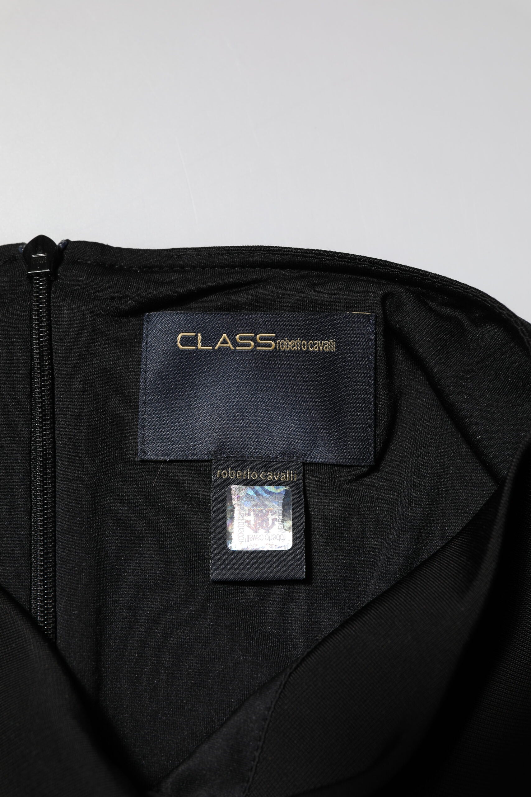 Black jacket with zippered pocket on front