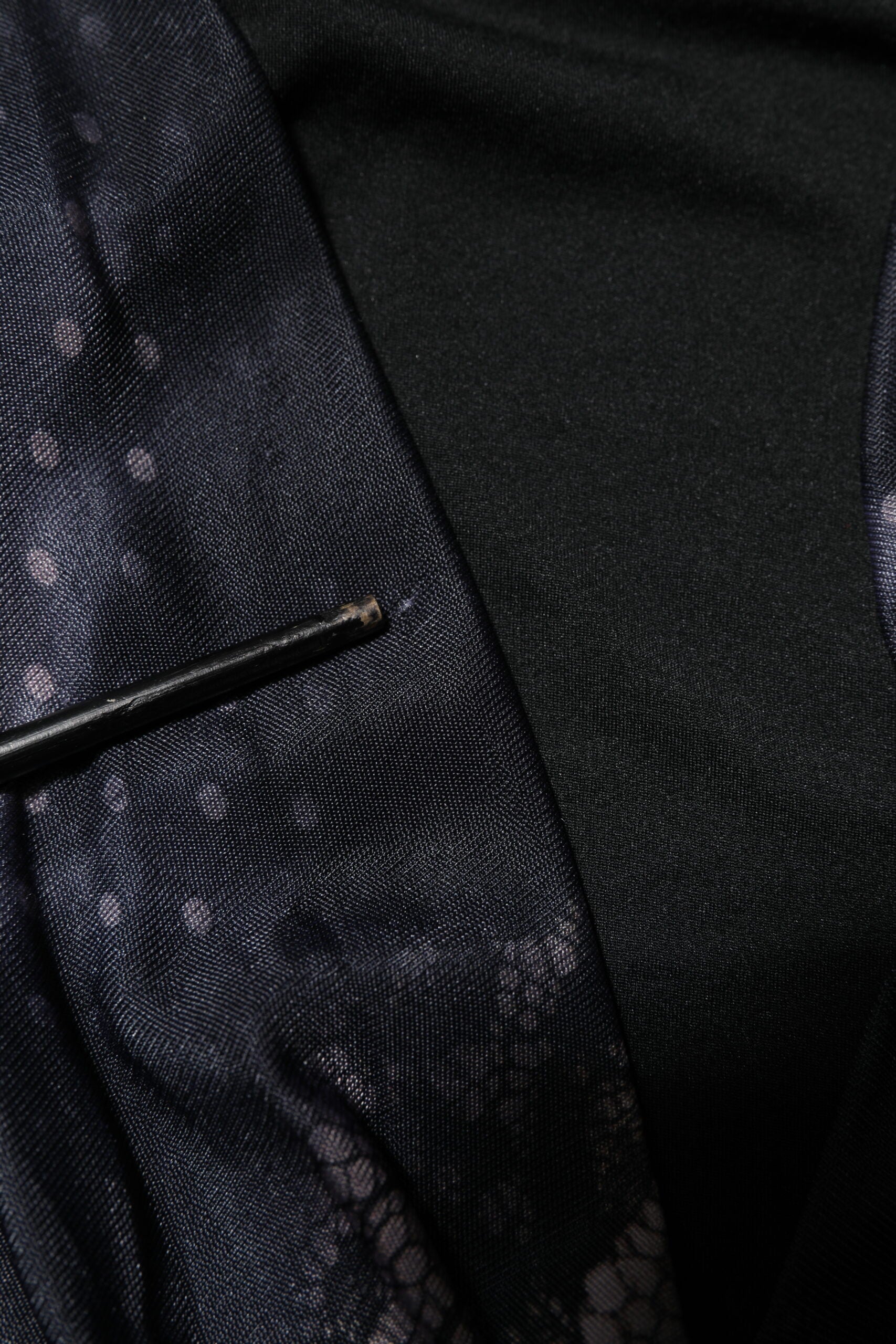 A black floral viscose sheath midi dress with a lace-up front and a long sleeve