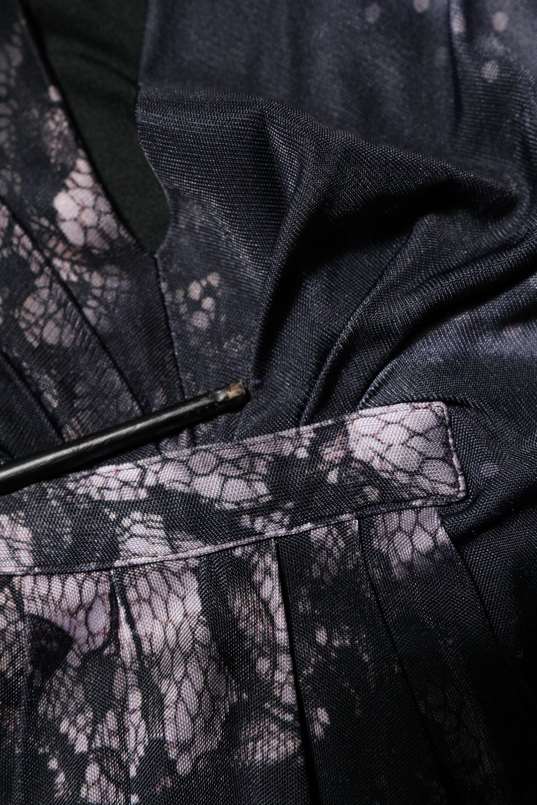 A black floral viscose sheath midi dress with a lace-like pattern on the sleeve