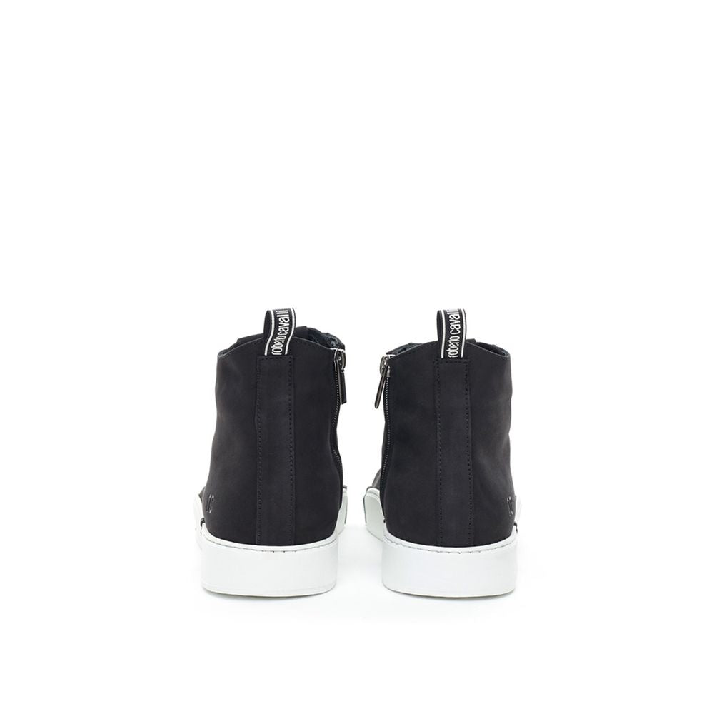 Pair of black suede boots with white laces and soles