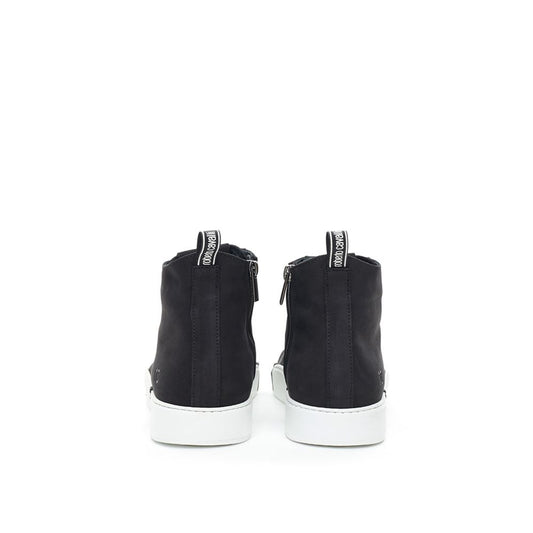 Pair of black suede boots with white laces and soles