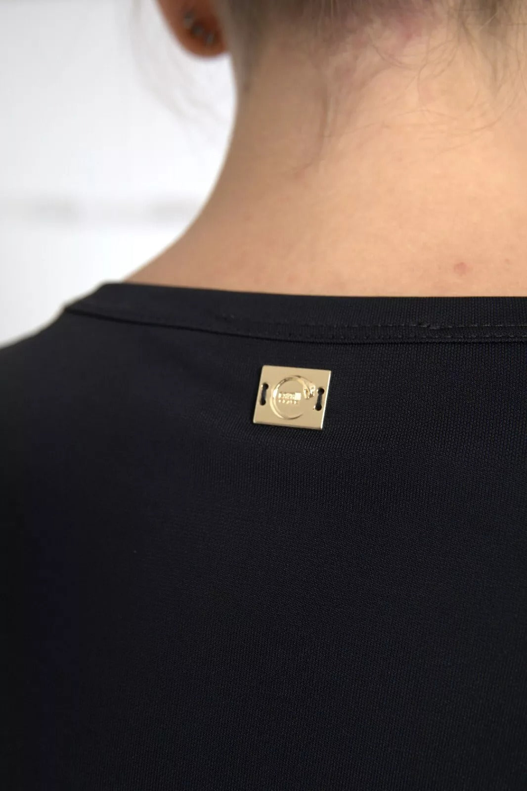 Tag on black fabric