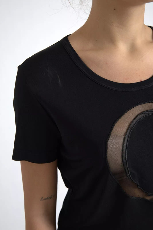 Woman wearing black t-shirt with moon graphic on front