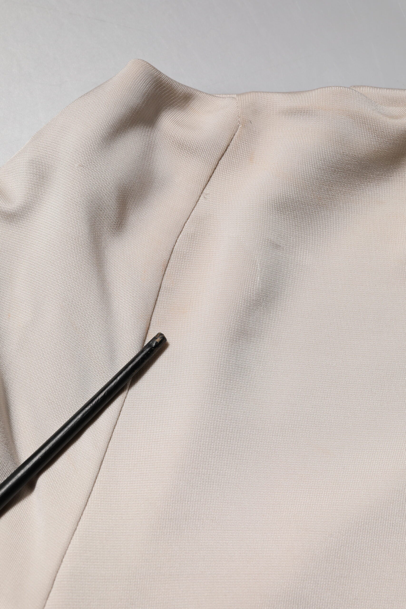 A knee length dress with a sheer viscose fabric and a textured pattern