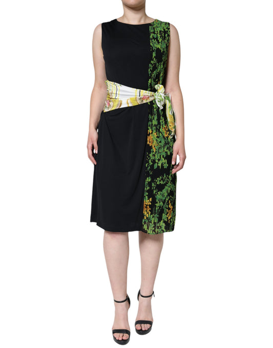 A knee length dress with a floral pattern on the front and back, featuring a black bodice and sleeves
