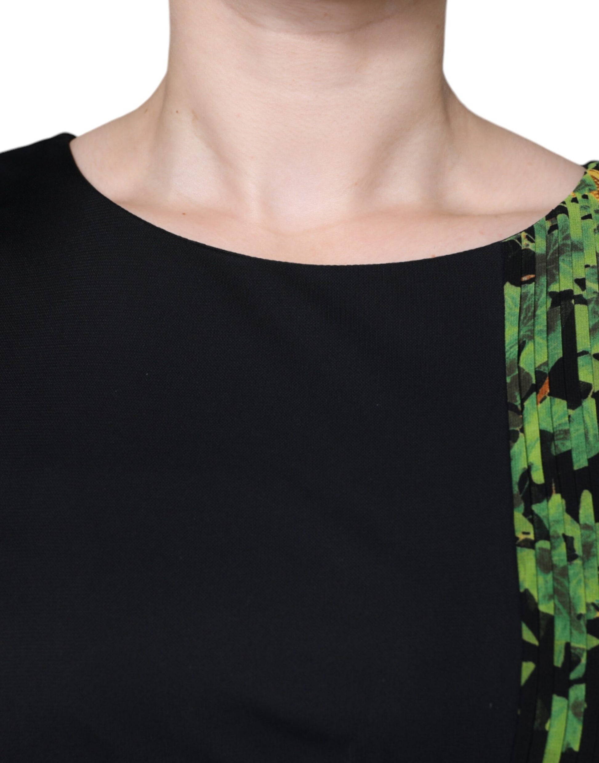 A black dress with a floral pattern on the front
