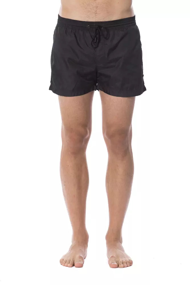Black swim trunks on a man's legs
