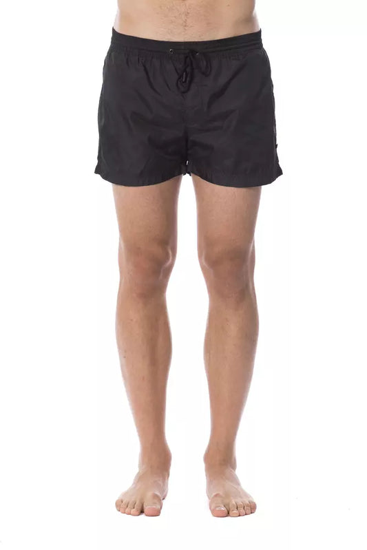 Black swim trunks on a man's legs