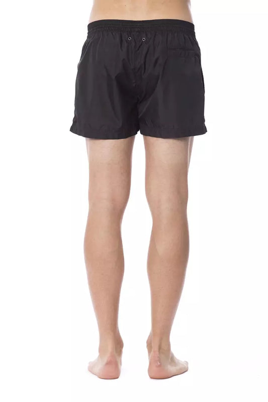 Black swim trunks on a mannequin torso