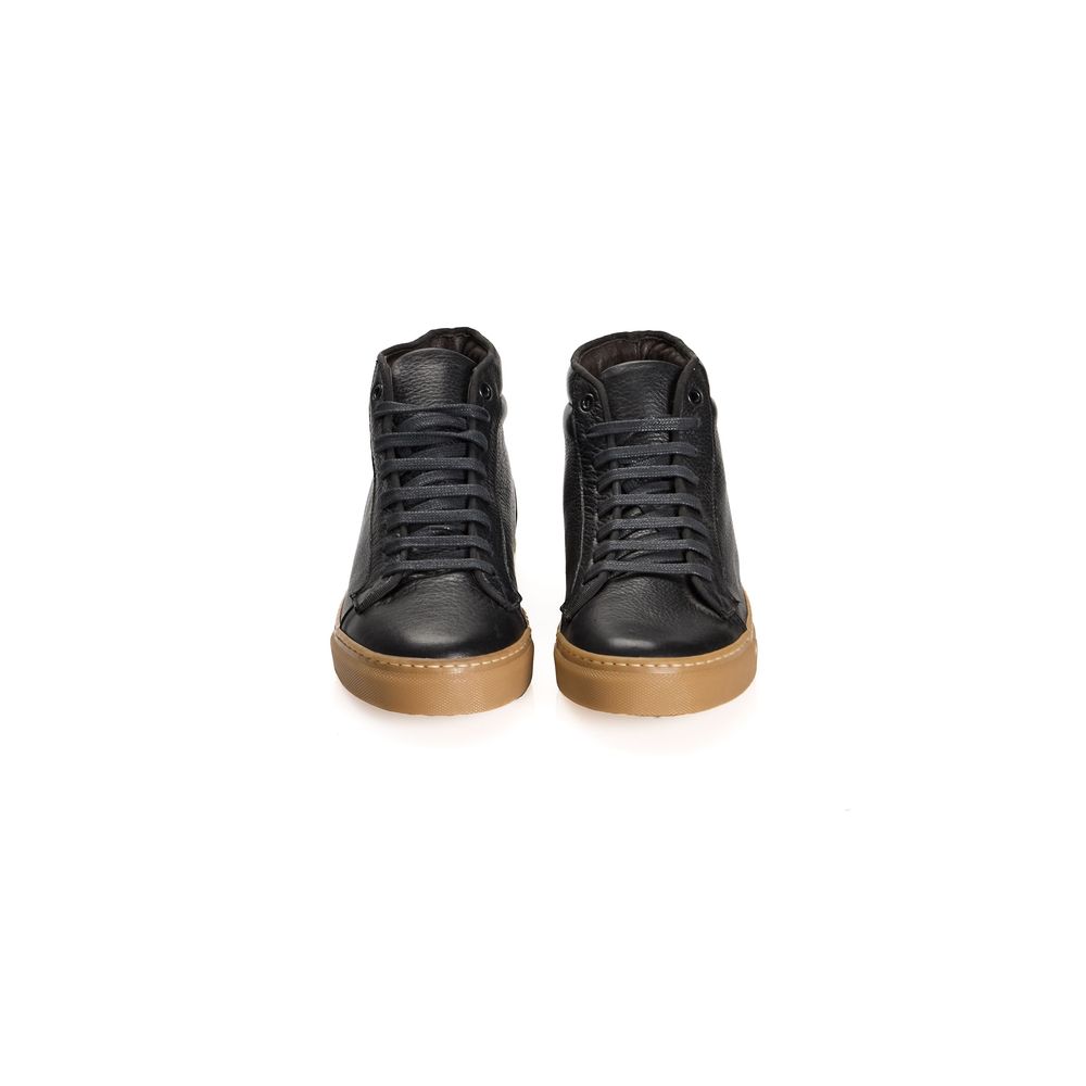 Pair of black calfskin men's sneakers with brown soles and laces, featuring a low-top design