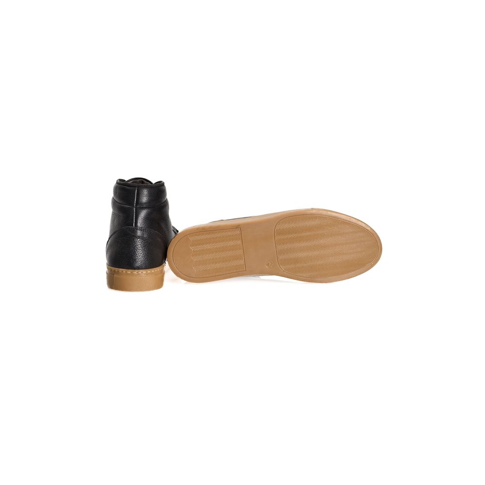 A single black calfskin men's sneaker with a tan rubber sole and laces
