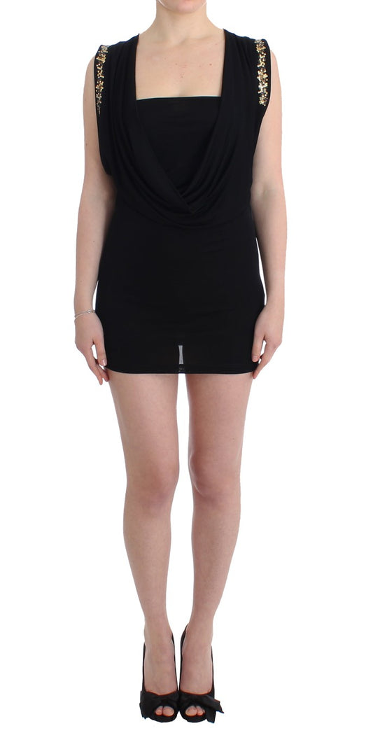 Black dress with gold accents on woman's body