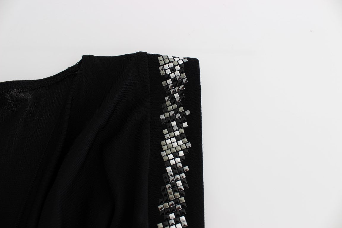 Black garment with sequin embellishment on sleeve