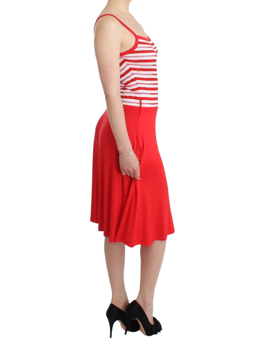 Woman wearing red skirt and white top