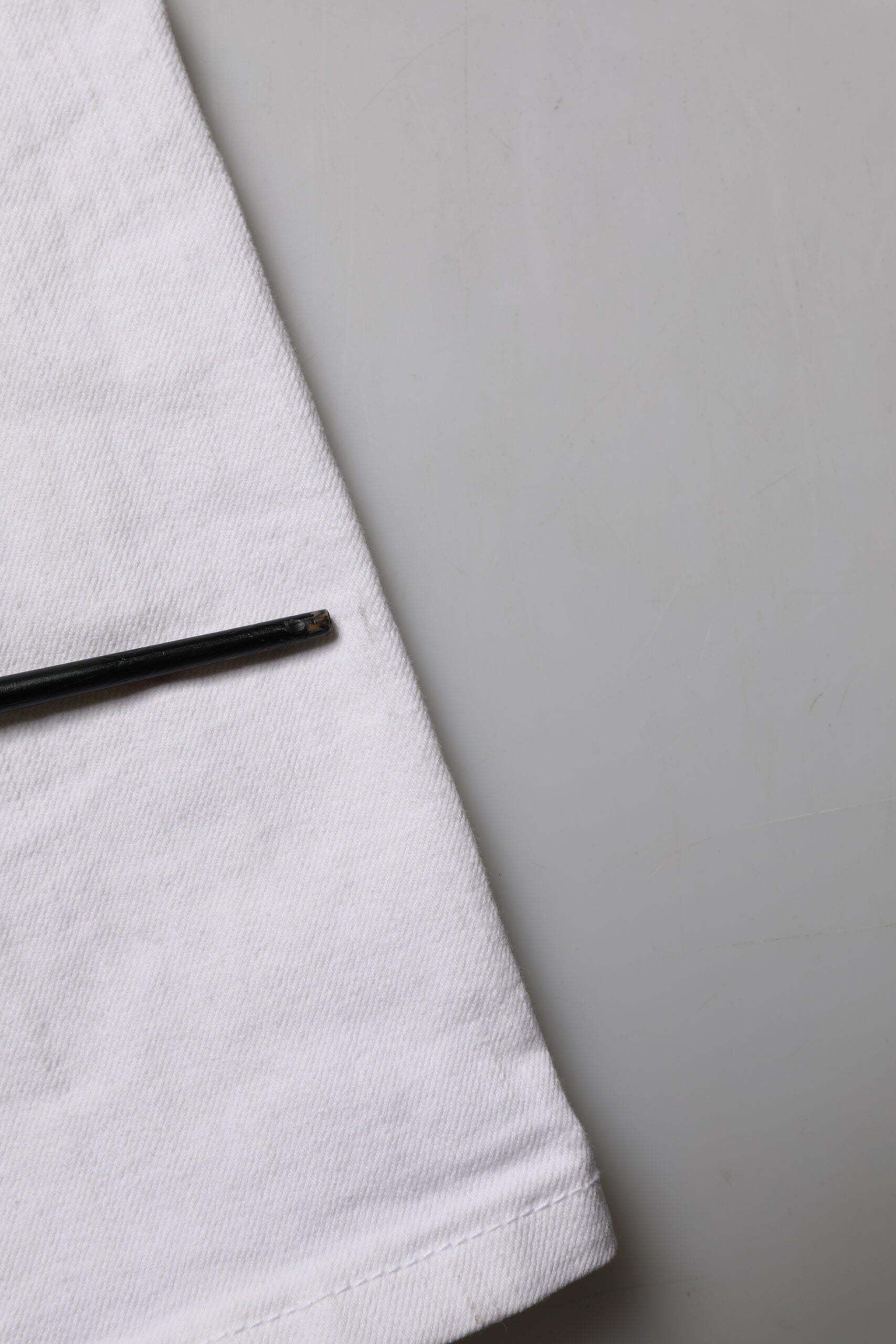 Black pen on white towel