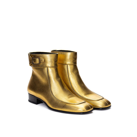 Gold leather boots with black soles