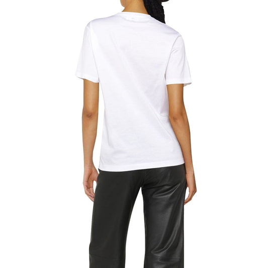 White t-shirt on a person wearing black pants