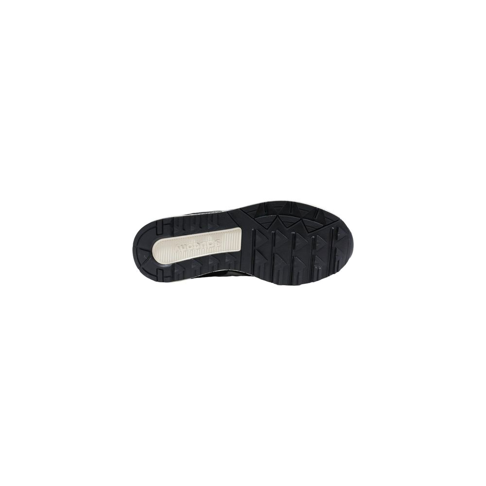 Black and white athletic shoe with laces, rubber sole, and bicolor leather upper