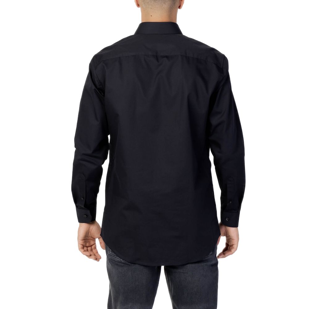 A black cotton dress shirt with a collar and long sleeves