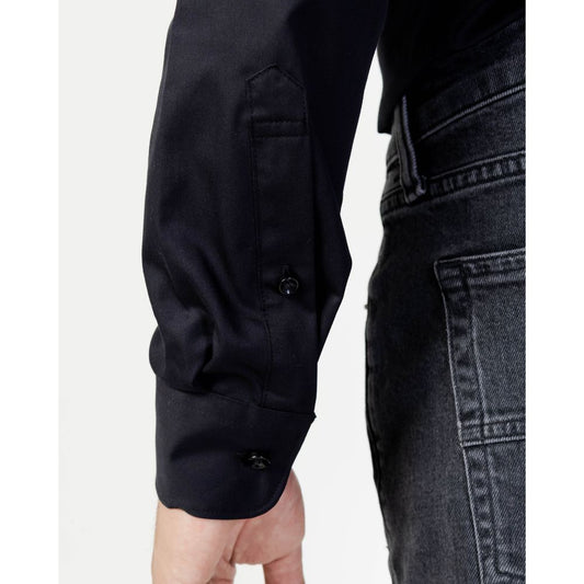 A black cotton dress shirt with long sleeves and buttons on the cuffs