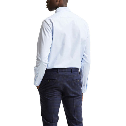 A mannequin wearing a blue dress shirt with a plaid pattern on the back
