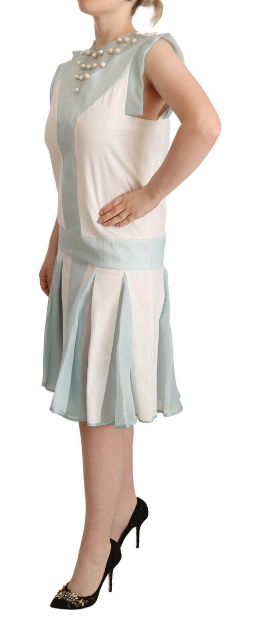 A sleeveless shift dress with a multicolored faux pearl design