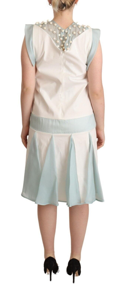 A sleeveless midi dress with a colorful pattern and faux pearls