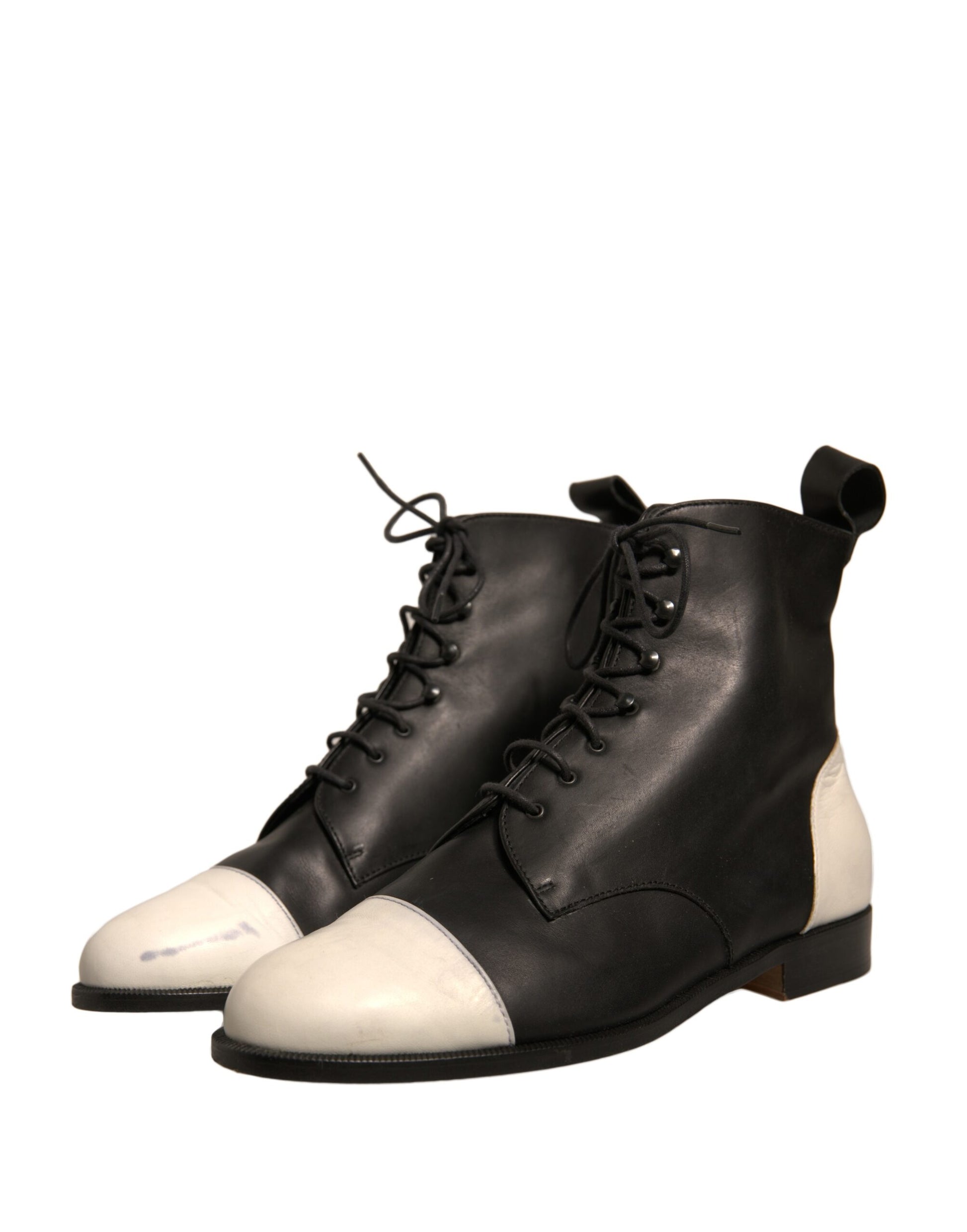 Pair of black boots with white laces