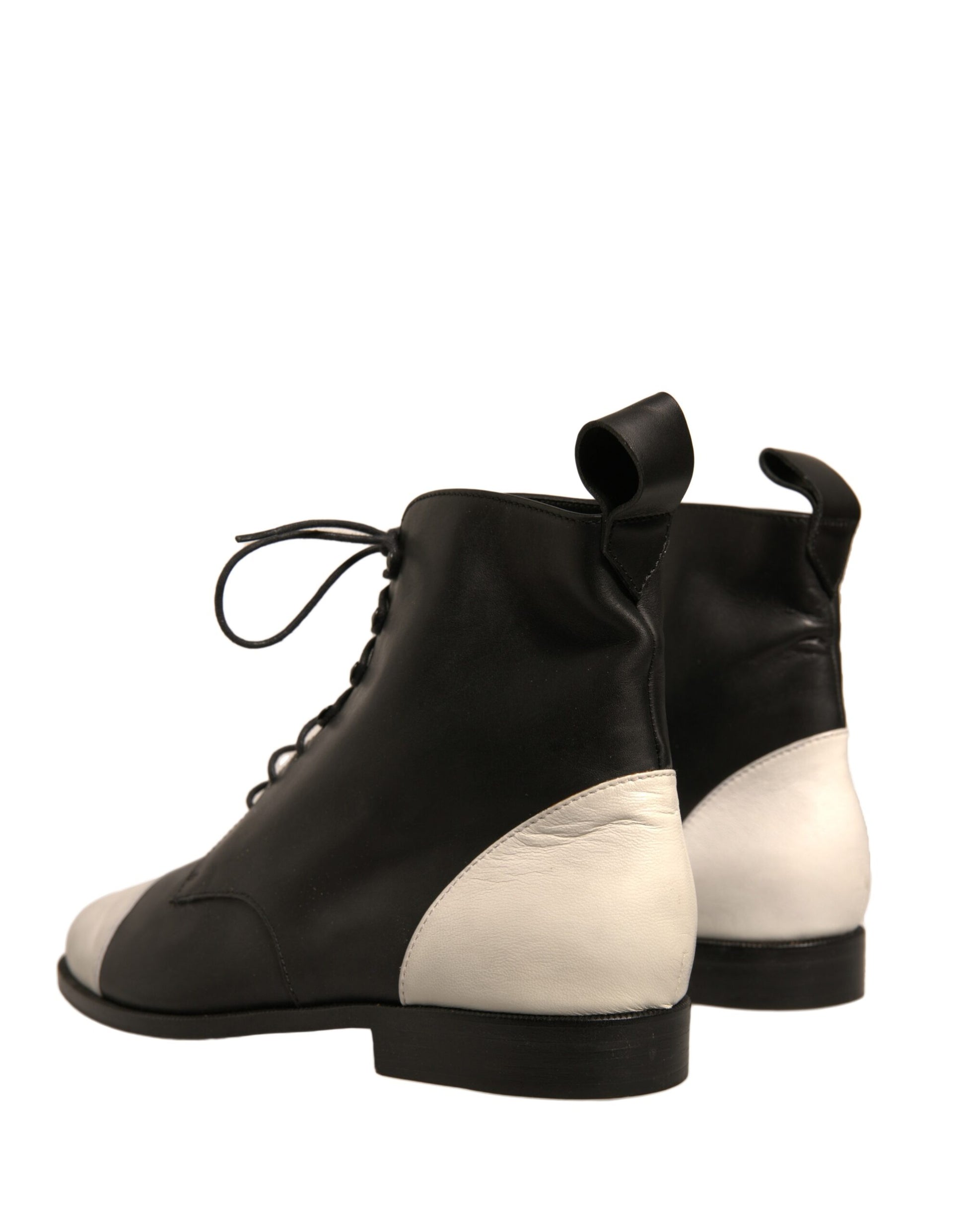 Pair of black boots with white accents
