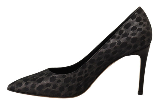 Black high heel shoe with patterned design on toe and heel