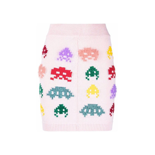 Pink sweater with pixelated dinosaurs