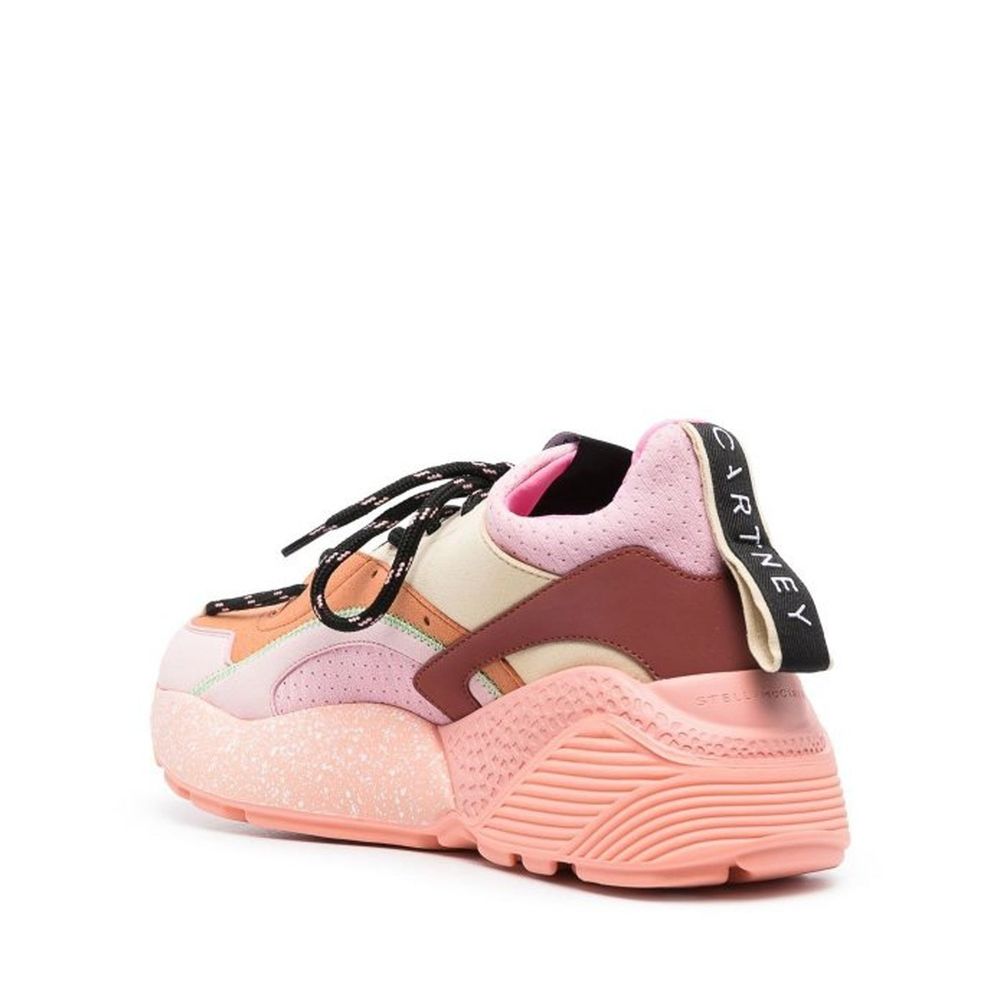 Pink sneaker with white laces