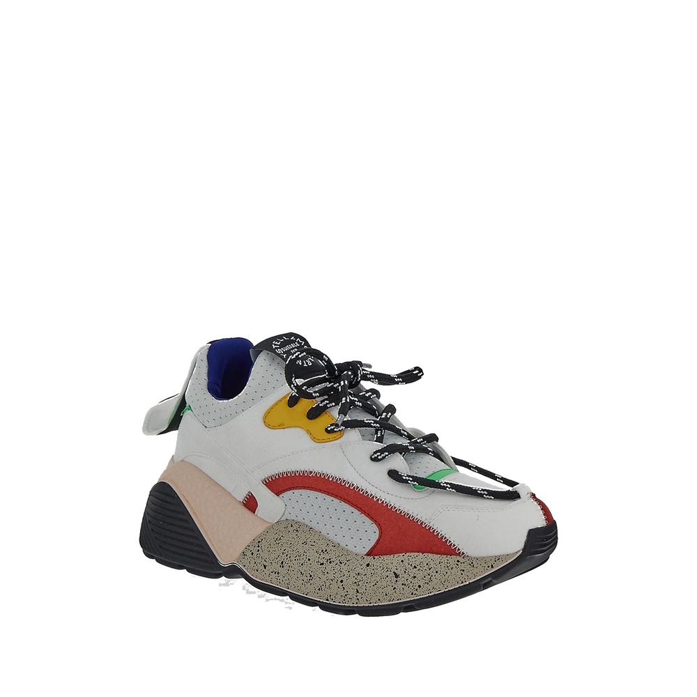 White sneaker with yellow stripe, black laces, and red accents