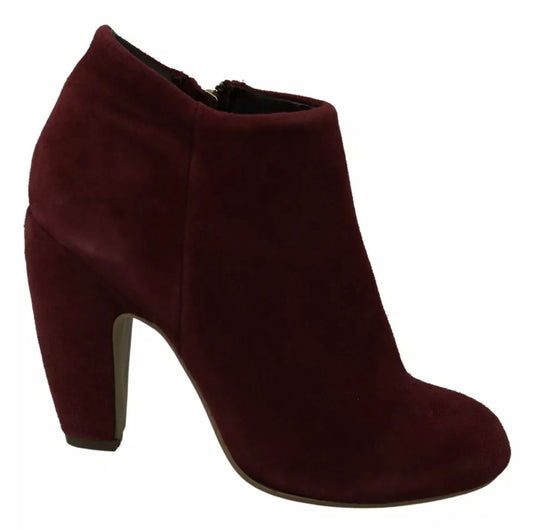 Pair of women's burgundy suede boots