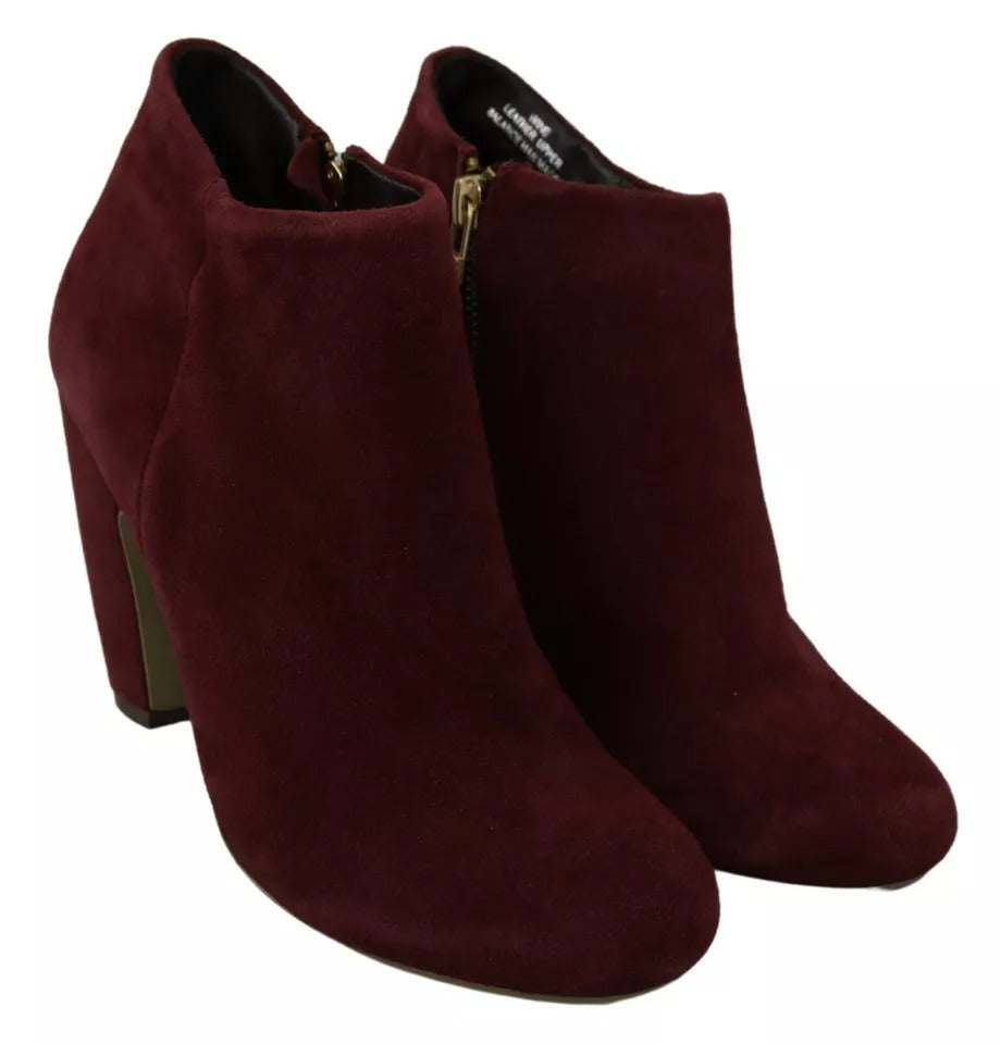 Pair of burgundy suede boots with heels