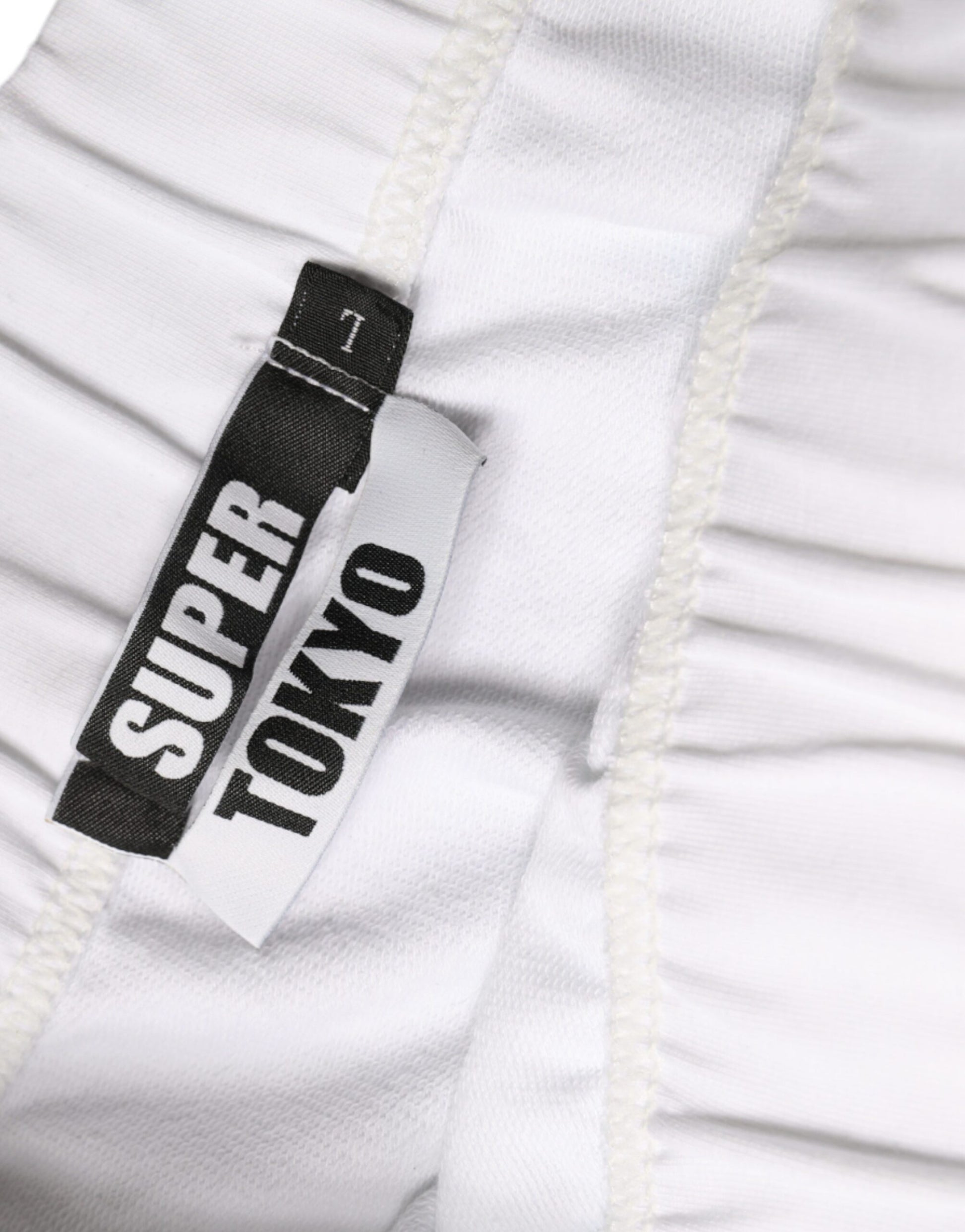 White briefs with black label reading "SUPER TOKYO"