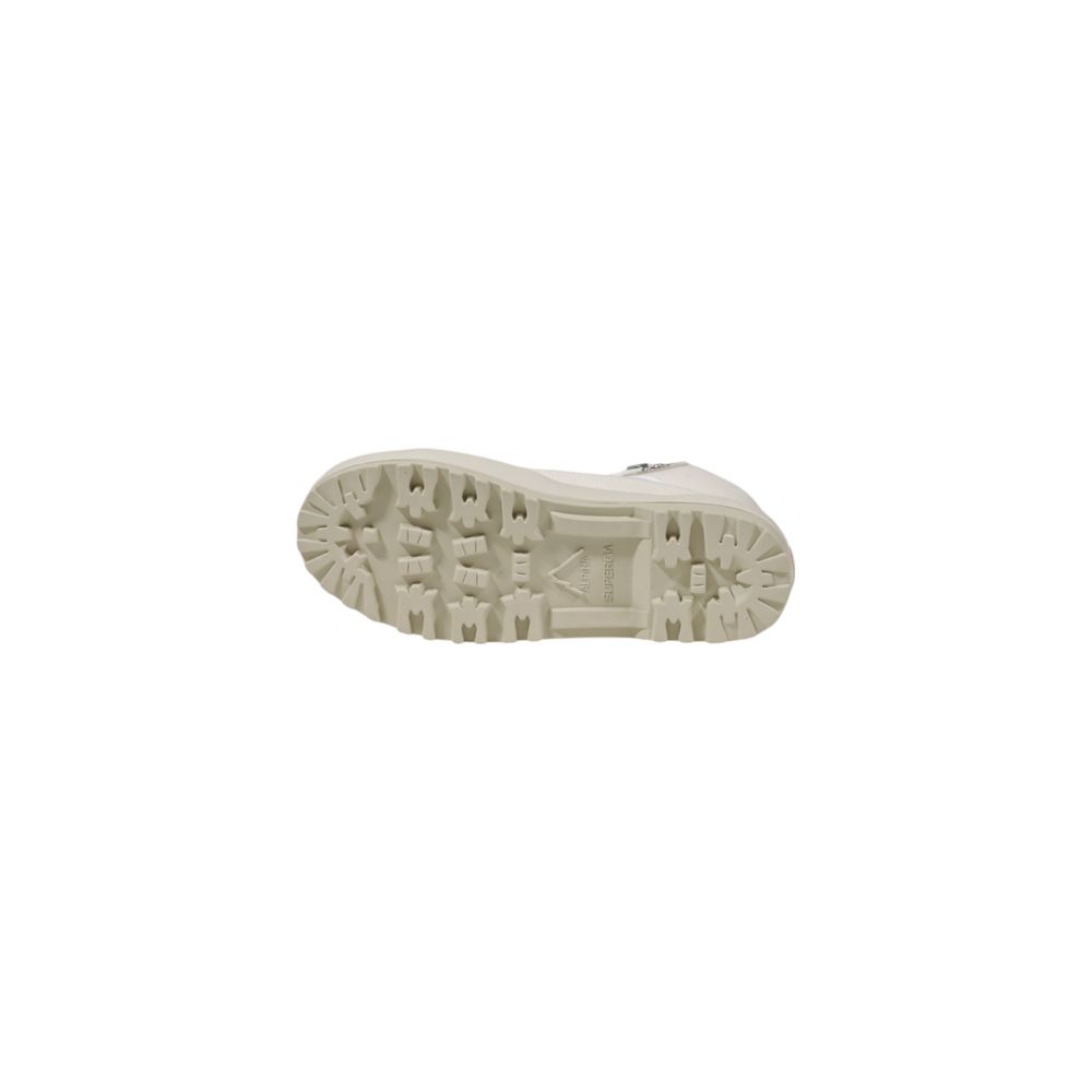 A single beige shoe with a textured sole