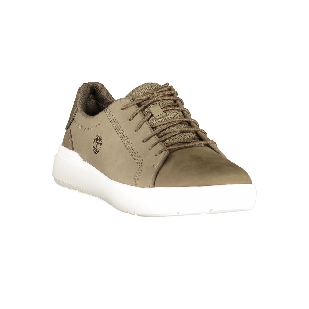 Brown men's shoe with white sole, laces, and logo