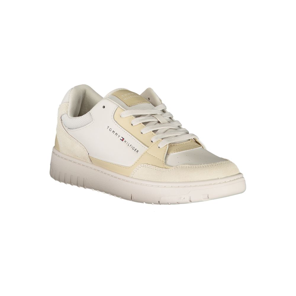 A beige men's sneaker with a white sole, featuring a logo on the side and a lace-up design