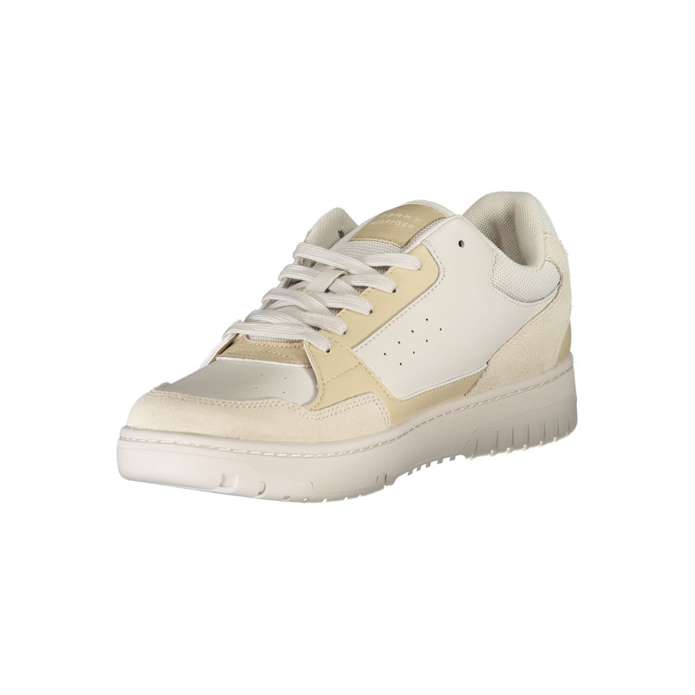 A beige men's sneaker with a white lace-up front and a rubber sole