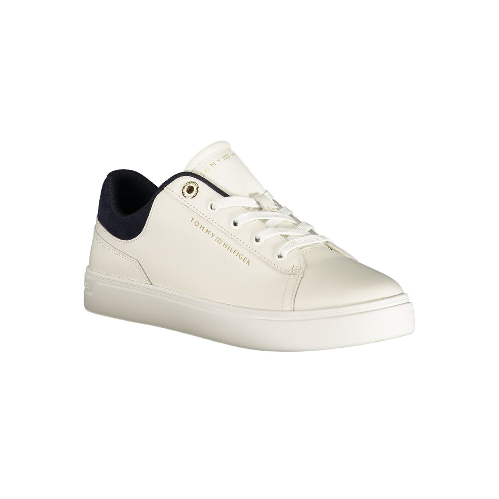 White sneaker with black laces, gold logo on side
